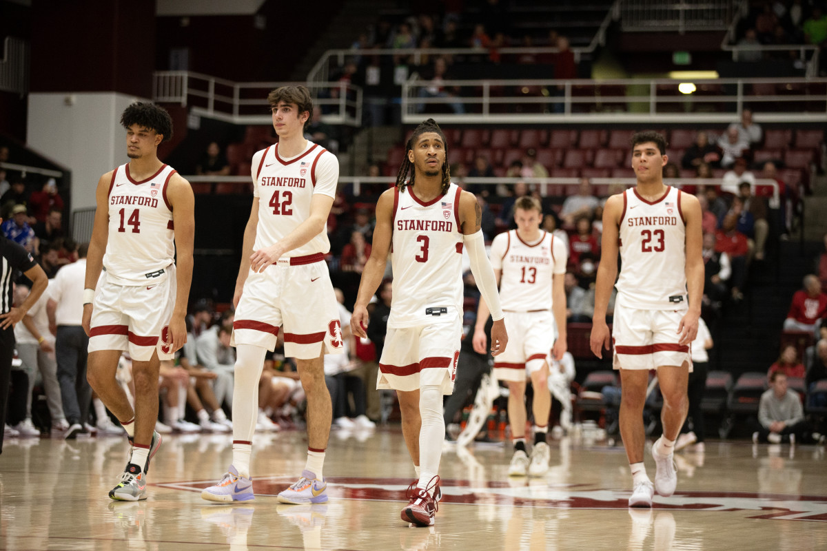 Feb 22, 2024; Stanford, California, USA; The Stanford Cardinal starting five forward Spencer Jones (14), forward Maxime Raynaud (42), guard Kanaan Carlyle (3), guard Michael Jones (13) and forward Brandon Angel (23) walk back onto the court follow a timeout during the first half against the Oregon Ducks at Maples Pavilion. Mandatory Credit: D. Ross Cameron-USA TODAY Sports